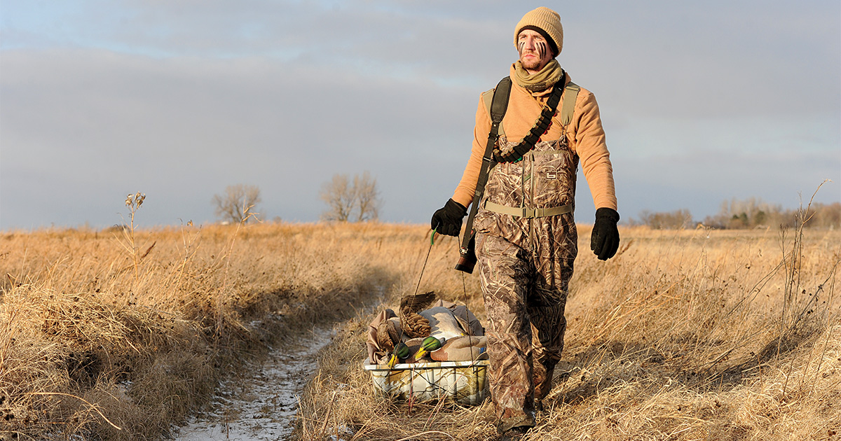 Hunter pulling decoy sled through field. Photo by Jim Thompson.jpg
